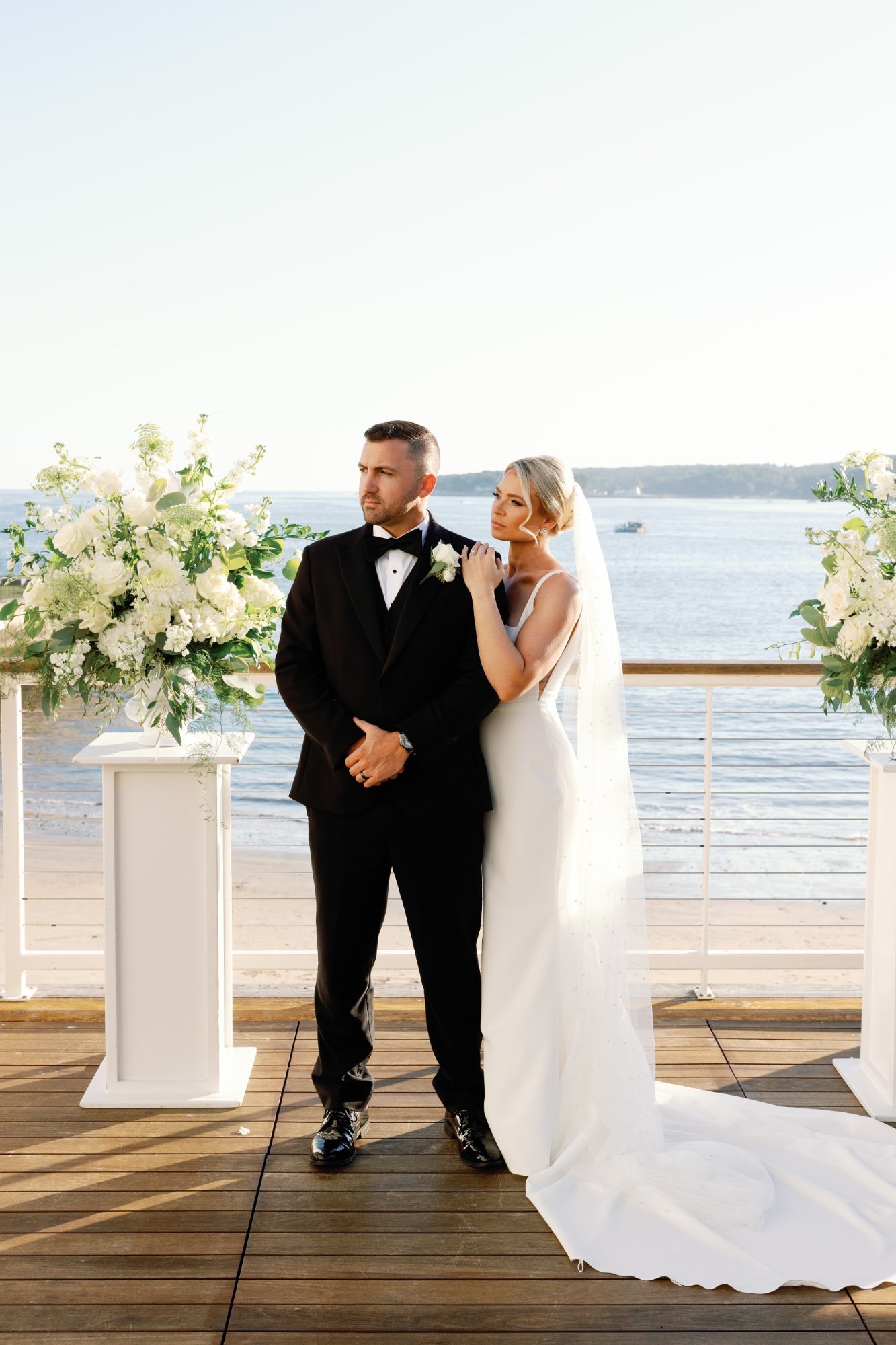 Wedding couple at waterfront ceremony